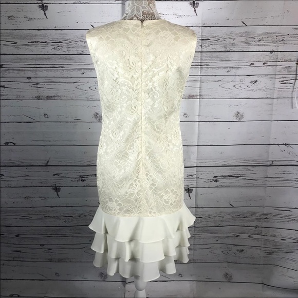Leslie Fay sleeveless 
Beautiful lace dress with layered ruffles on the end. - Picture 7 of 12